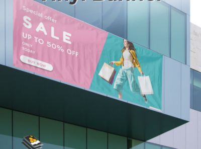 Custom vinyl banner with full color print displayed outdoors on wall with grommets